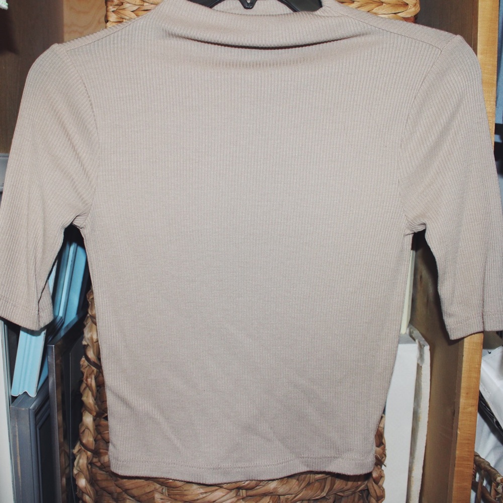 Tight tan short turtle neck cropped shirt